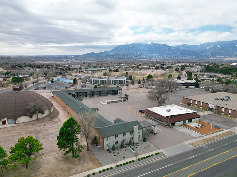 Aerial view of The Montelena with mountains and Pikes Peak in the background